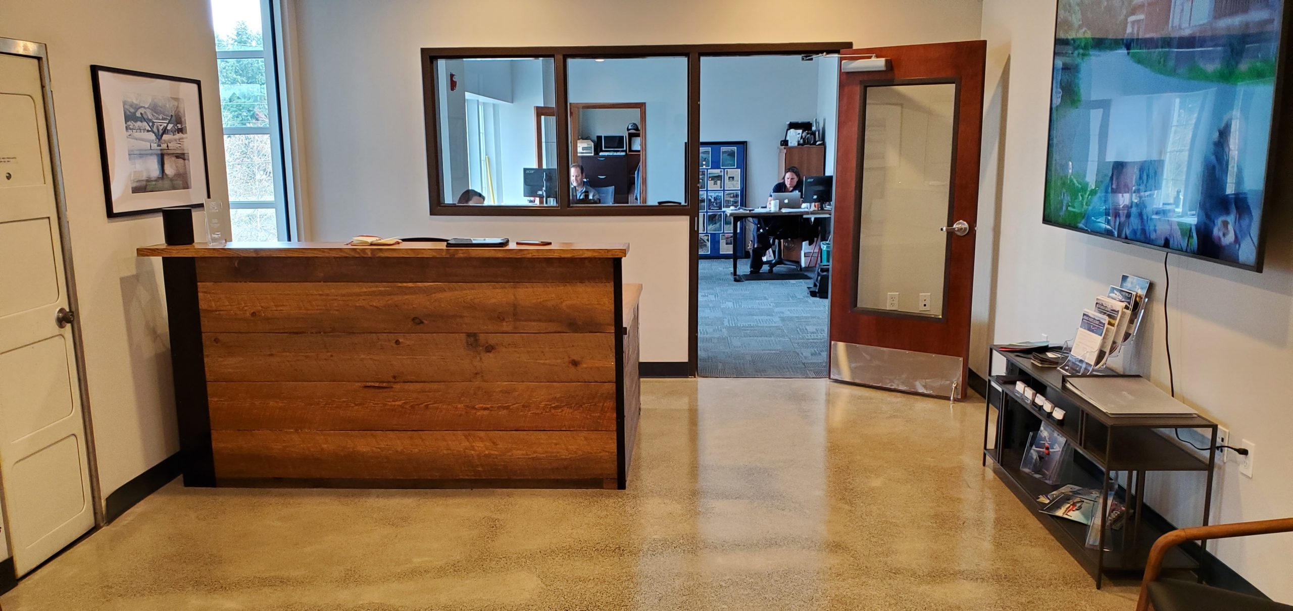 Before-view of reception desk, with no signage.